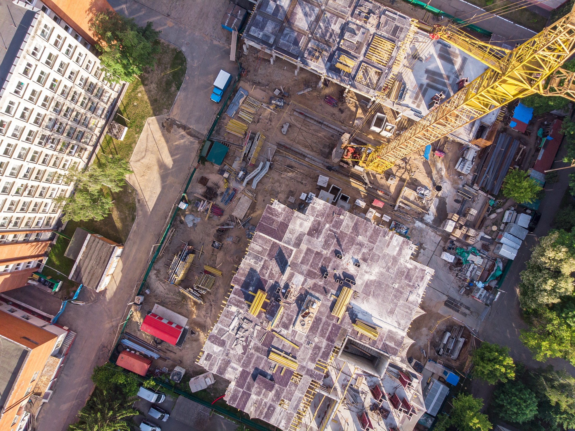 flying drone over civil construction site in progress